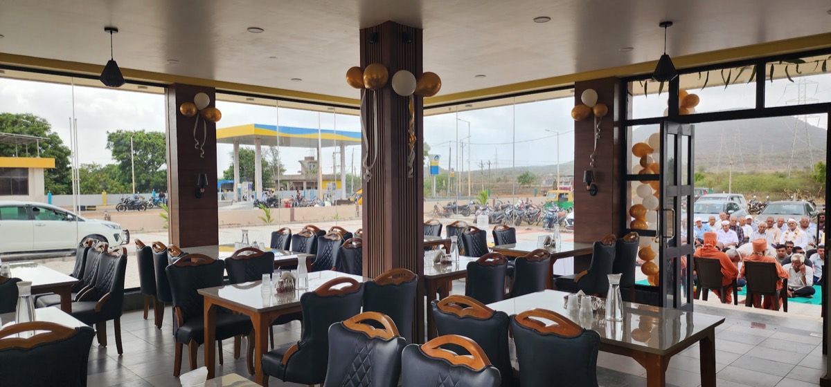 Dining hall with cushioned chairs and wide windows